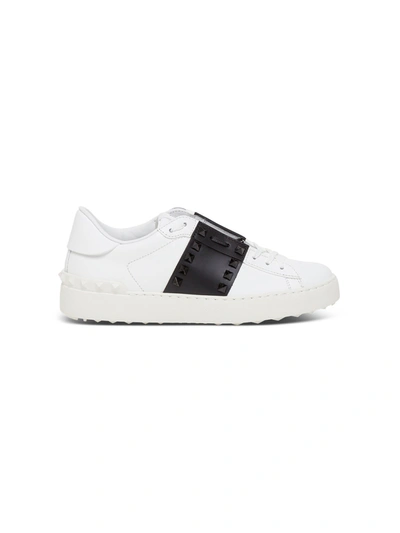 Shop Valentino Utitled Rockstud Sneakers In Leather With Black Band In White/black