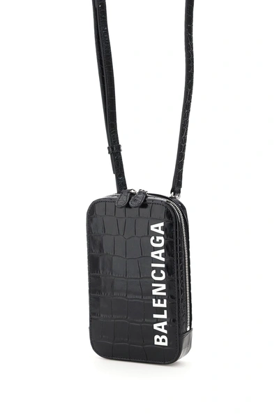 Shop Balenciaga Phone Bag With Cash Logo Shoulder Strap In Blk Wht