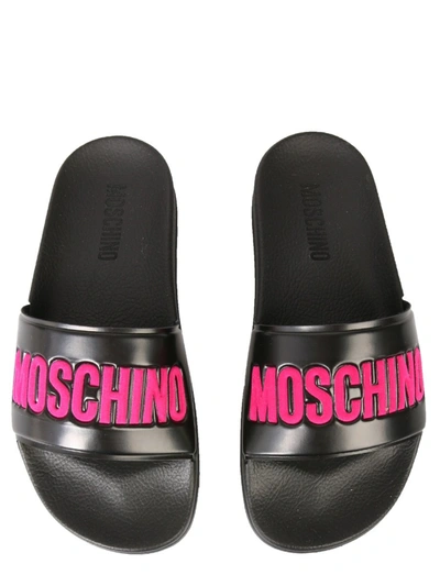 Shop Moschino Slide Sandals In Fuchsia