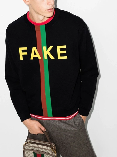 Shop Gucci Sweatshirt Mit "fake/not"-print In Schwarz