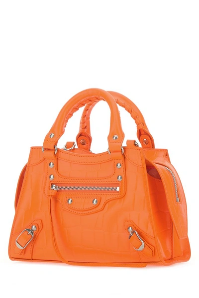 Shop Balenciaga Neo Classic Mini Top Handle Bag In Orange