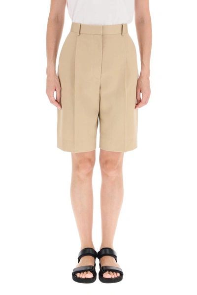 Shop The Row Straight Leg Bermuda Shorts In Beige