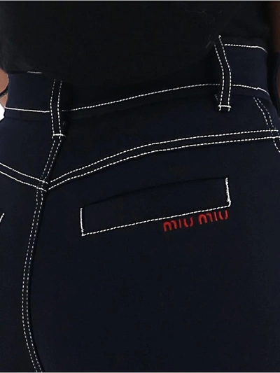 Shop Miu Miu Belted Flared Jeans In Blue