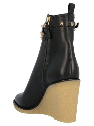 Shop Valentino Garavani Rockstud Wedge Ankle Boots In Black