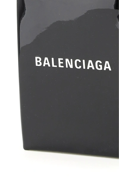 Shop Balenciaga Shopping Phone Bag Logo In Black