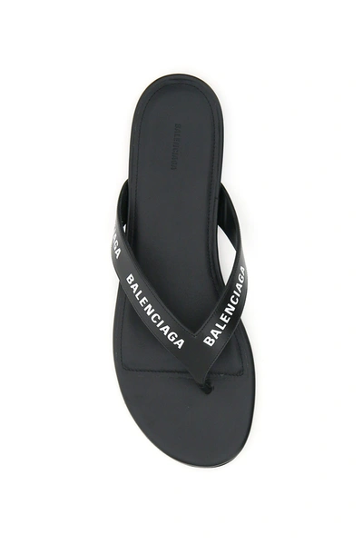 Shop Balenciaga Round Leather Thong Mules Logo In Black