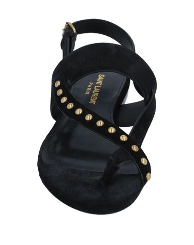 Shop Saint Laurent Toe Strap Sandals In Black