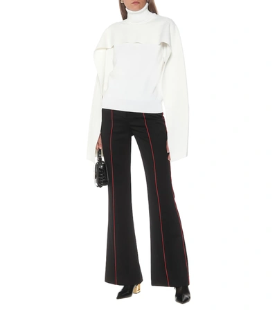 Shop Givenchy High-rise Flared Wool Pants In Black