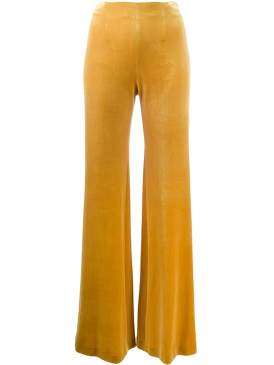 Shop Galvan Flared Velvet Trousers In Yellow