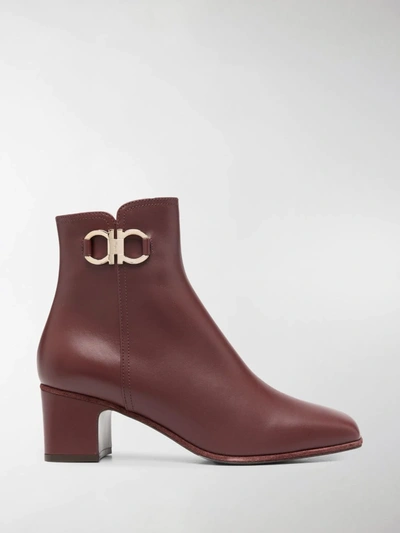 Shop Ferragamo Gancini Plaque Ankle Boots In Red