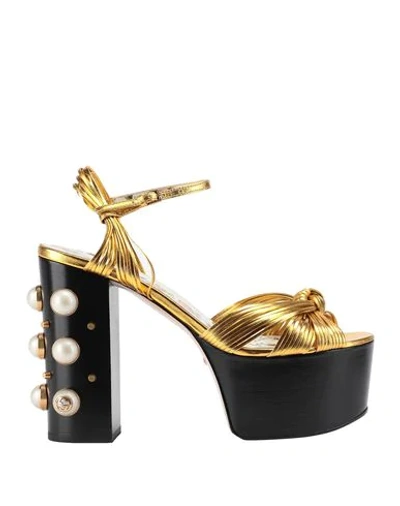 Shop Gucci Sandals In Gold