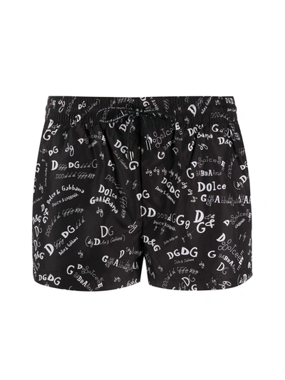 Shop Dolce & Gabbana All-over Logo Print Swim Shorts In Black