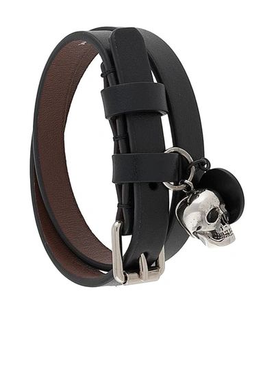 Shop Alexander Mcqueen Skull-embellished Logo Bracelet In Black