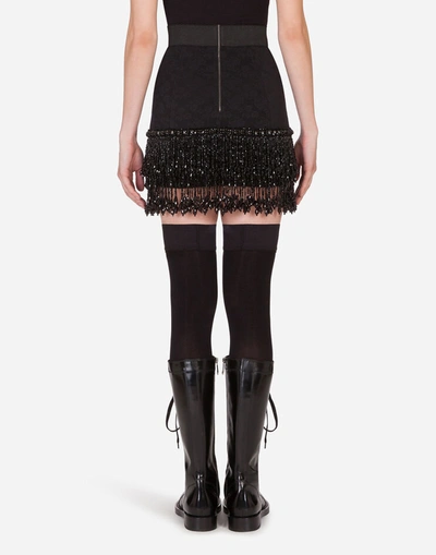 Shop Dolce & Gabbana Embroidered Lace Miniskirt In Black