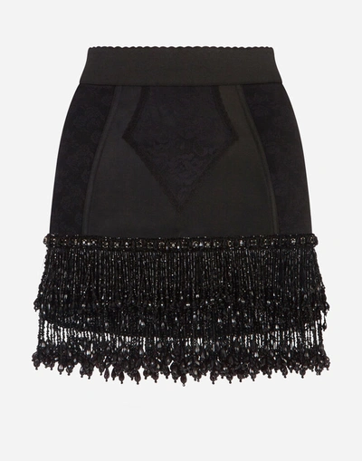 Shop Dolce & Gabbana Embroidered Lace Miniskirt In Black