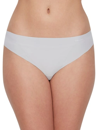 Shop Calvin Klein Invisibles Thong In Jet Grey