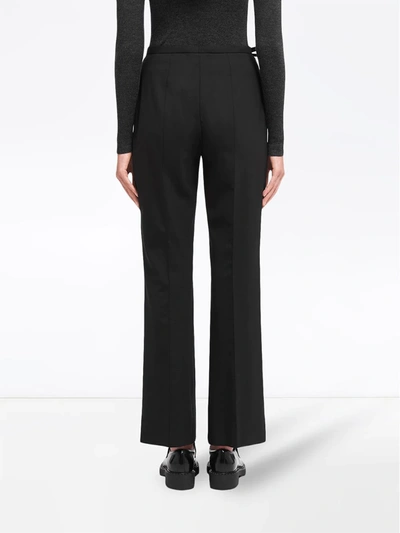 Shop Prada Bow-detail Trousers In Black