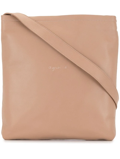Shop Agnès B. Logo Embossed Messenger Bag In Brown