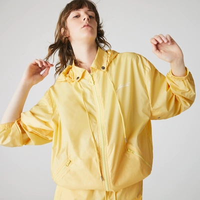 Shop Lacoste Women's  Live Lightweight Collapsible Zip Rain Jacket In Yellow
