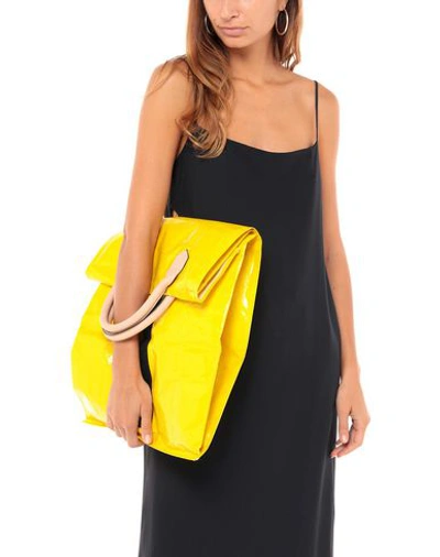 Shop Aalto Handbags In Yellow