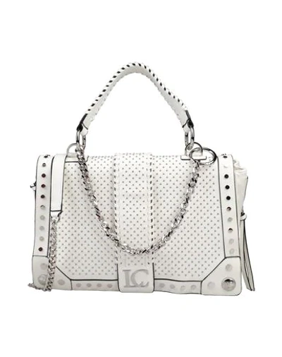 Shop La Carrie Handbags In White