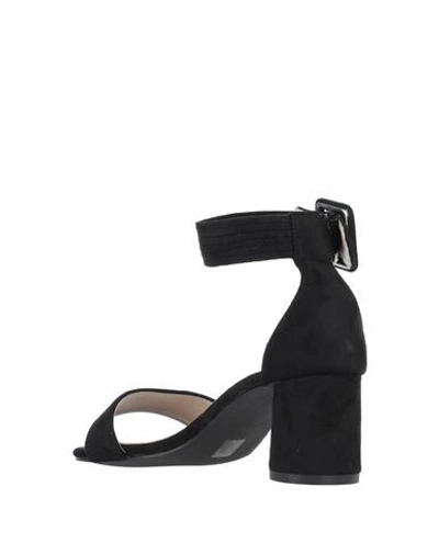 Shop Romeo Gigli Sandals In Black
