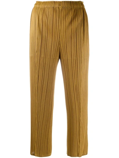 Shop Issey Miyake Plissé Cropped Trousers In Gold