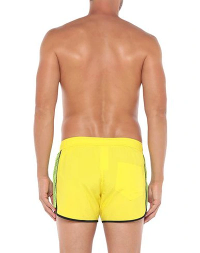 Shop Moschino Swim Trunks In Yellow