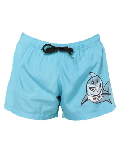 Shop Moschino Swim Trunks In Sky Blue