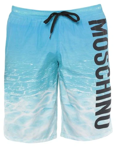 Shop Moschino Swim Trunks In Azure
