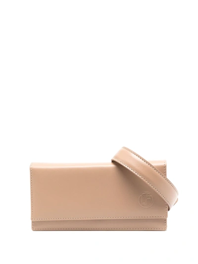Shop Linda Farrow Embossed-logo Leather Belt Bag In Neutrals