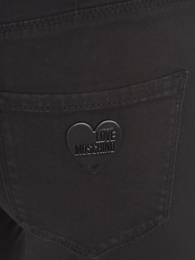 Shop Love Moschino Logo Plaque Skinny Jeans In Black