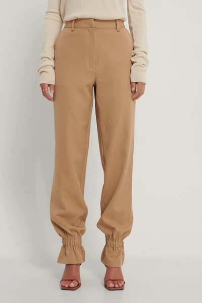 Shop Gine Margrethe X Na-kd Suit Pants With Elastic - Brown In Nougat