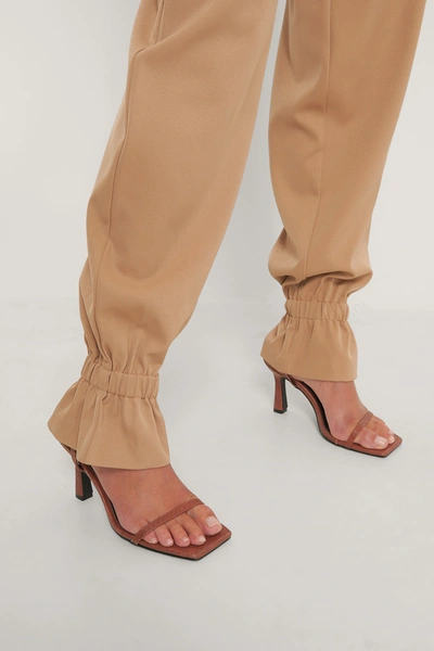 Shop Gine Margrethe X Na-kd Suit Pants With Elastic - Brown In Nougat