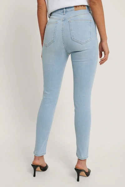 Shop Na-kd Reborn Organic Ripped Hem Skinny Cropped Jeans - Blue In Light Blue