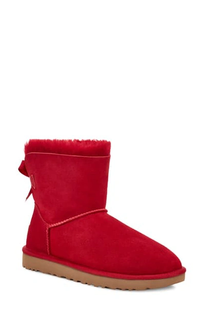 Shop Ugg Mini Bailey Bow Ii Genuine Shearling Bootie In Kiss Suede