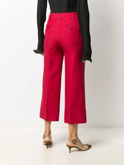 Shop Valentino Cropped Virgin Wool Trousers In Red