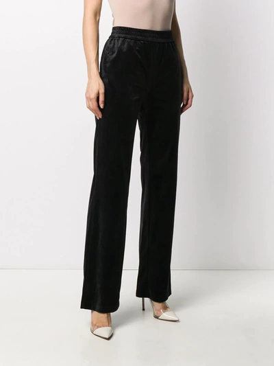 Shop Emporio Armani Embroidered Bear Straight Trousers In Black