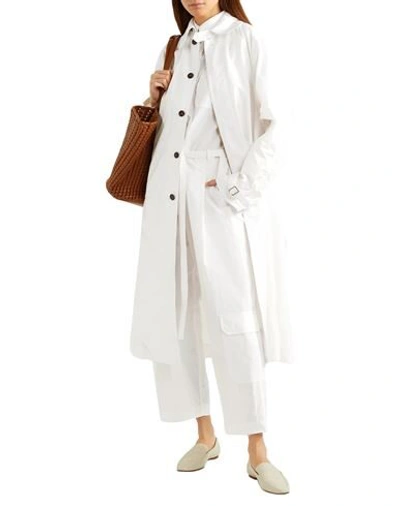 Shop Deveaux Overcoats In White