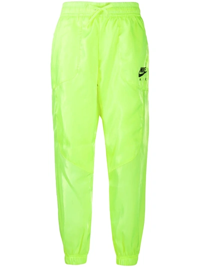 Shop Nike Logo Print Track Pants In Yellow