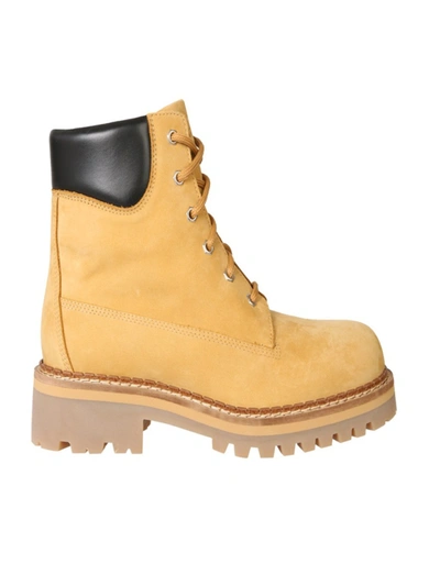 Shop Moschino Combat Beige Leather Ankle Boots In Yellow