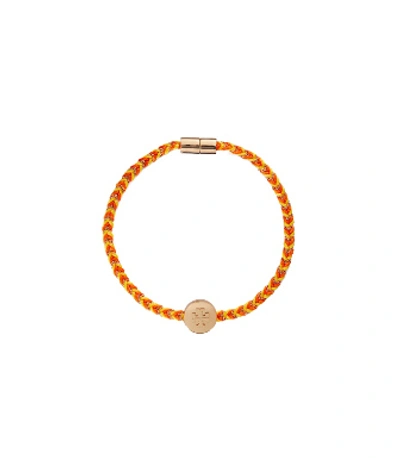 Shop Tory Burch Kira Braided Bracelet In Tory Gold / Goldfinch / Candied Orange
