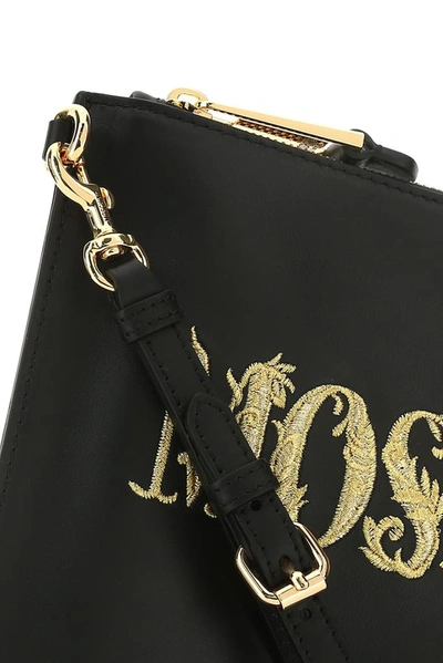 Shop Moschino Logo Embroidered Clutch Bag In Black