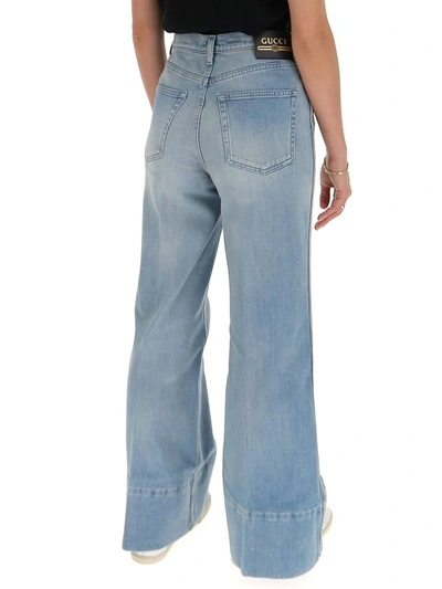 Shop Gucci Glitter Logo Patch Flared Jeans In Blue