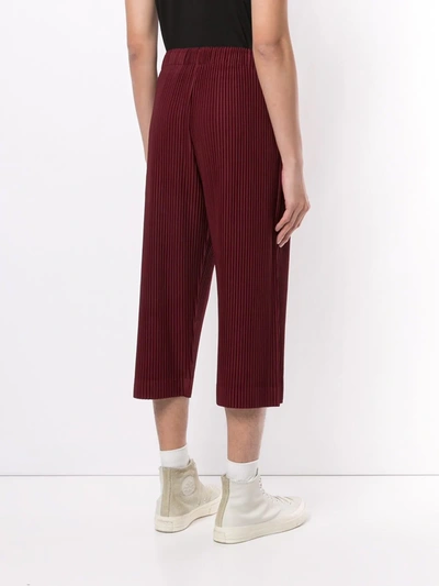 Shop Issey Miyake Pleated Cropped Trousers In Red