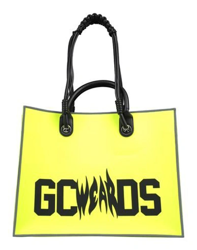 Shop Gcds Handbags In Yellow
