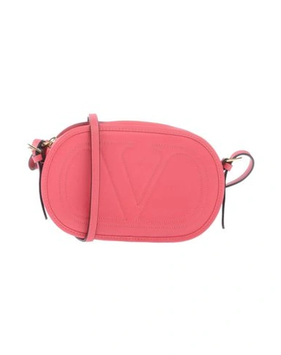Shop Valentino Handbags In Coral