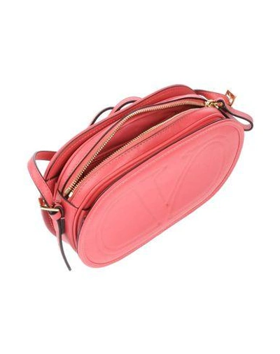 Shop Valentino Handbags In Coral