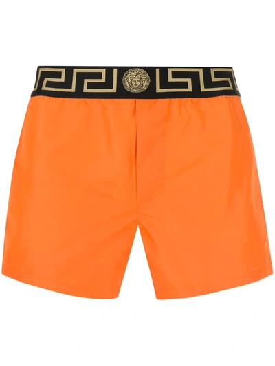 Shop Versace Greca Waistband Boxer Shorts In Orange