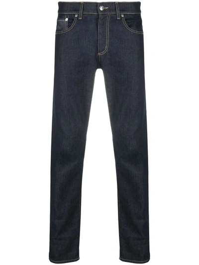 Shop Alexander Mcqueen Studded Logo Slim-fit Jeans In Blue